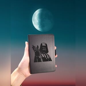 One small laser engraved notebook.